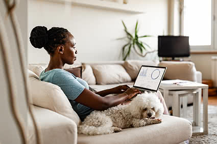 A woman working at home due to pandemic isolation.